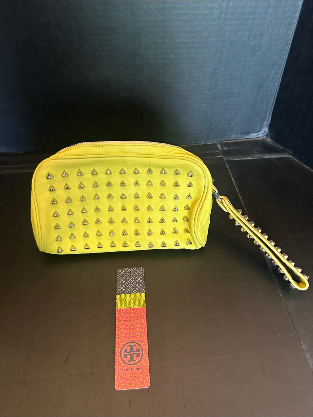 Authentic Tory Burch yellow leather large wristlet with silver studs